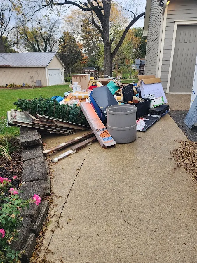 Dumpster being loaded with debris for 12 Yard Dumpster Rental in Mount Juliet